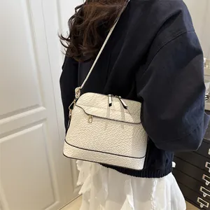 Chic cream woven texture shell bag with gold zippers and slim shoulder strap for women