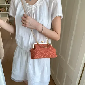 Retro orange tweed woven crossbody bag with gold heart lock and chain strap for women