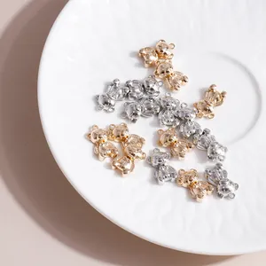 Detail of 3D bear metal charms in gold and silver finish for DIY jewelry making