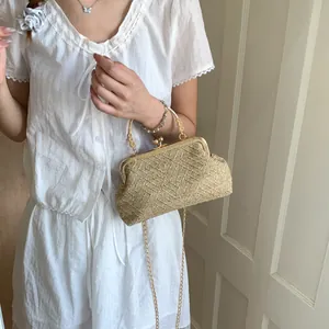Retro straw handbag with golden floral handle and chain strap for women in summer