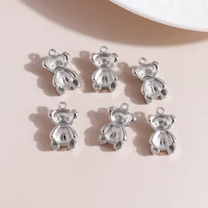 Detailed view of silver bear-shaped jewelry pendants with top loop for DIY crafting