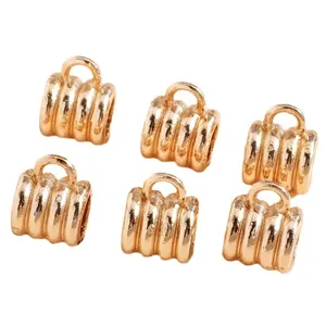 Pack of 6 gold plated twisted textured cylinder charms with hanging loops for DIY jewelry