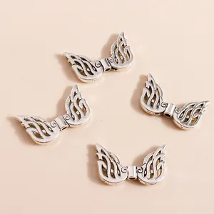 Retro hollow wing charms in silver finish for DIY jewelry making pendants