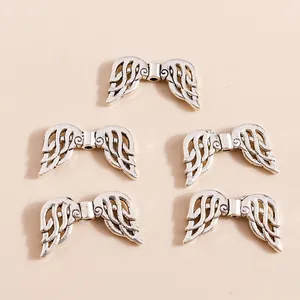 Five silver angel wing alloy pendants for DIY jewelry making with detailed feather textures