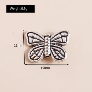 Detailed size chart showing silver vintage butterfly pendant dimensions 15mm by 11mm