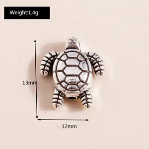 Macro detail of retro sea turtle charm with precise 13mm by 12mm dimensions and 1.4g weight