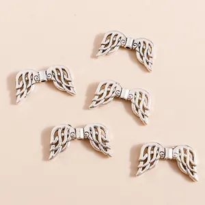 Set of hollow angel wing charms in vintage silver finish for DIY jewelry making