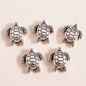 Detailed macro of vintage silver turtle beads for DIY jewelry and bracelet crafting