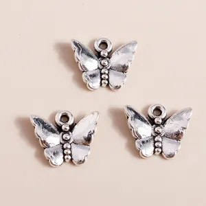 Set of three vintage silver butterfly charms in plated alloy for DIY jewelry making
