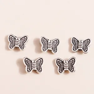 Five vintage silver alloy butterfly pendants for DIY jewelry making and bracelets