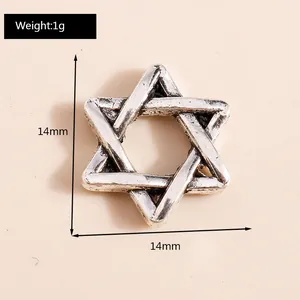 Macro detail of a 14mm retro silver alloy hollow hexagram pendant for DIY jewelry
