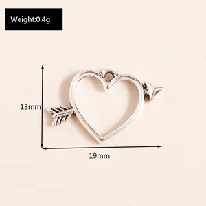 Macro detail of Cupid arrow heart alloy pendant showing dimensions 19x13mm and 0.4g weight