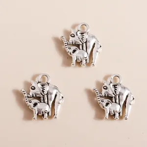 Close-up of vintage silver elephant charms with mother and child detail for DIY jewelry