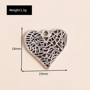 Macro view of vintage silver hollow heart pendant with 18mm by 19mm size dimensions