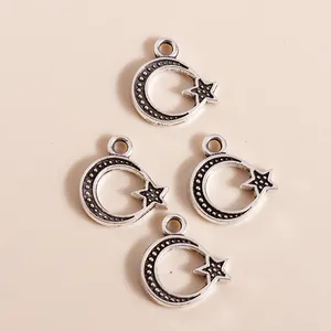 Set of four vintage antique silver moon and star alloy pendants for DIY jewelry making