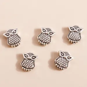 Five vintage silver owl charms for DIY jewelry making featuring intricate feather details