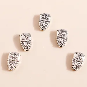 Retro silver owl charms in vintage zinc alloy with intricate feather textures for DIY jewelry
