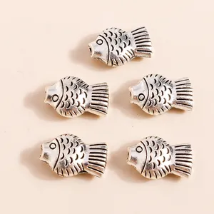 Five vintage silver plated alloy koi fish pendants for DIY jewelry making and crafts