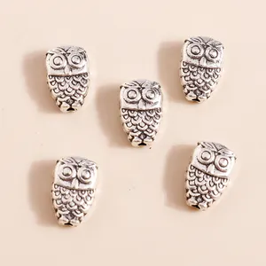 Five vintage silver alloy owl charms for DIY jewelry making featuring intricate feather details