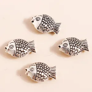 Vintage silver-plated koi fish charms with detailed scale textures for DIY jewelry making
