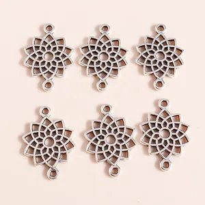 Macro shot of silver plated alloy hollow lotus heart pendants with double loop connectors