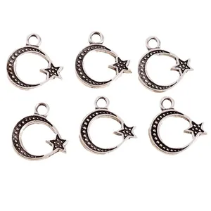 Set of vintage silver alloy star and moon charms with detailed relief for jewelry making