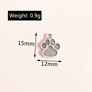 Detail of paw-shaped alloy charms in antique silver finish with weight and size markings