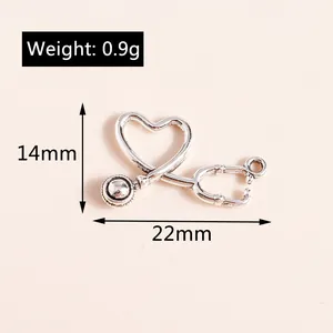 Detailed view of silver heart stethoscope alloy pendant with 14mm by 22mm measurements