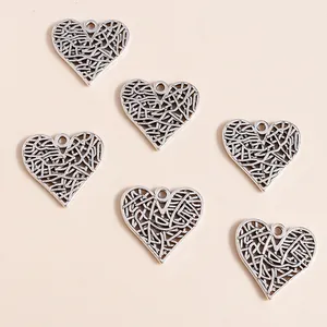 Pack of vintage hollow heart alloy pendants with intricate vine textures for DIY jewelry