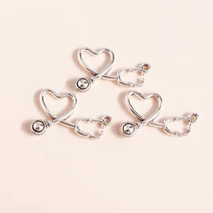 Detail of silver alloy stethoscope heart charms for DIY jewelry making accessories