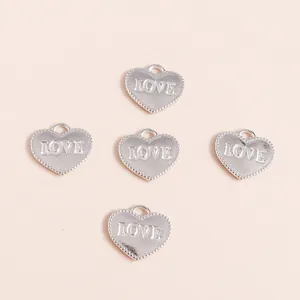 Five heart-shaped silver alloy pendants with LOVE engraving for DIY jewelry making
