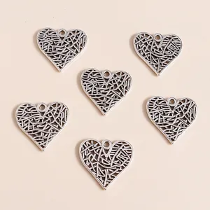Pack of vintage hollow heart charms in antique silver alloy for DIY jewelry making