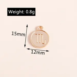 Macro detail of a 15mm gold Scorpio zodiac charm with weight and size dimensions