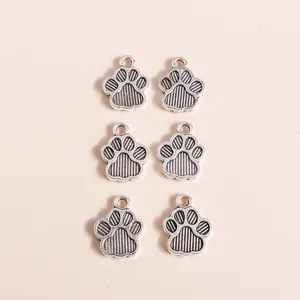 Silver alloy animal paw pendants with vertical stripe texture and integrated hanging loops