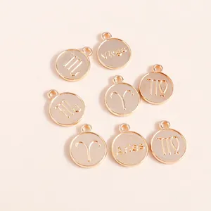 Detailed close-up of golden zodiac sign charms for DIY jewelry making accessories