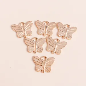 Set of six butterfly alloy pendants with gold plating and fine wing textures
