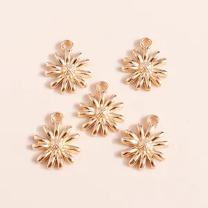 Five gold plated alloy daisy flower pendants with round hanging loops for jewelry making