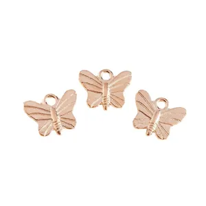 Set of three rose gold butterfly insect charms with intricate wing textures for DIY jewelry