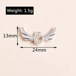 Detailed view of silver heart wing pendant showing 13mm height and 24mm width dimensions