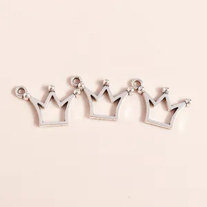 Detailed view of hollow crown alloy pendants in silver finish for DIY jewelry making