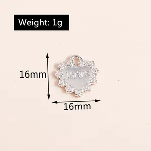 Detailed macro view of 16mm heart alloy pendant with LOVE engraving and 1g weight