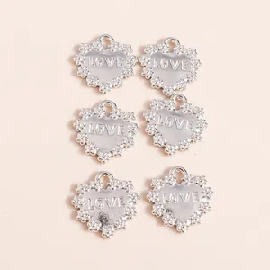 Set of six silver heart-shaped alloy charms with LOVE engraving and scalloped edges