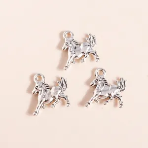 Macro detail of three retro silver alloy running horse charms with top hanging loops