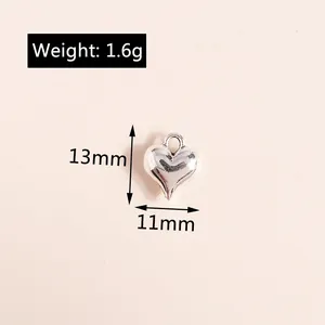 Macro shot of 13mm silver plated 3D heart pendant with weight and size specifications