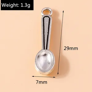 Detailed view of silver spoon pendant with dimensions 29mm by 7mm and 1.3g weight