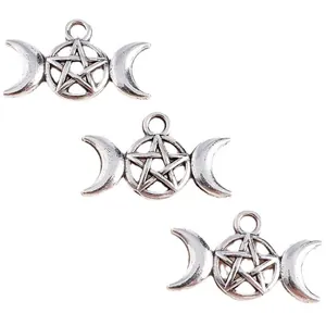 Detailed view of silver triple moon and pentagram alloy charms for DIY jewelry