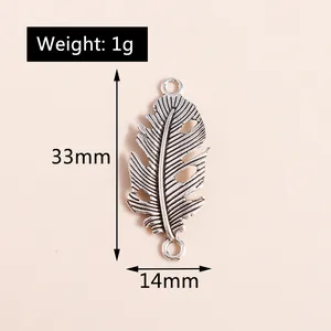 Detail view of hollow feather charms showing dimensions 33mm by 14mm and 1g weight