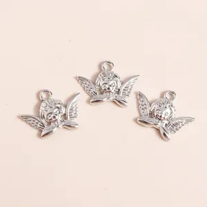 Detailed view of three silver plated vintage angel charms for DIY jewelry making