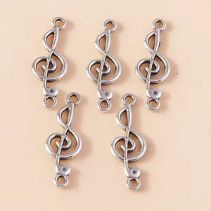 Detailansicht der Vintage-Silber-Notenschlüssel-Anhänger mit zwei Ösen für DIY-Schmuck