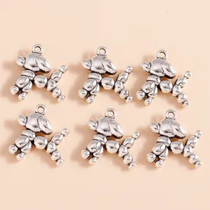 Detailed view of six antique silver balloon dog pendants for DIY jewelry crafting